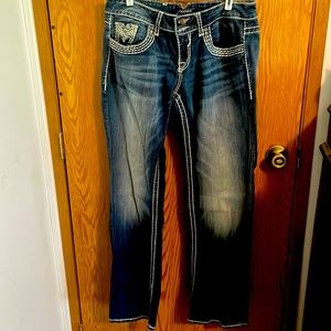 Dark blue boot cut decorative stitching throughout